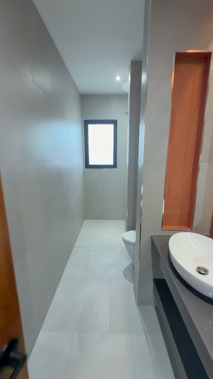The double-basin bath — Koh Samui, Thailand · teak and stone
