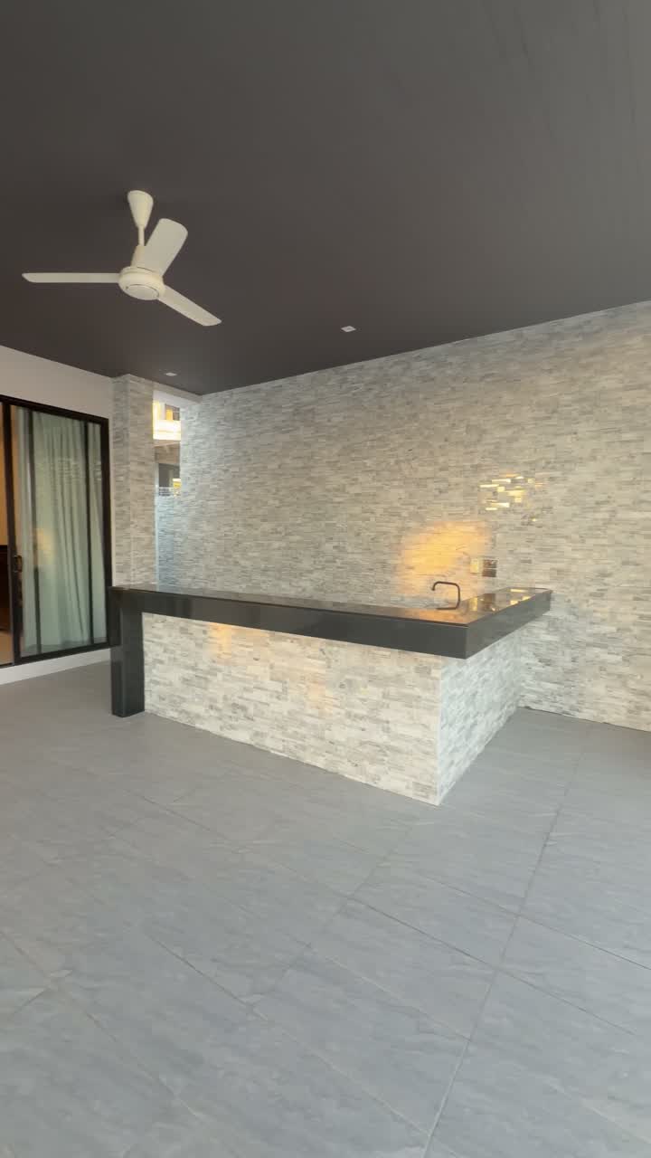 The stone counter — Koh Samui, Thailand · the living-room island