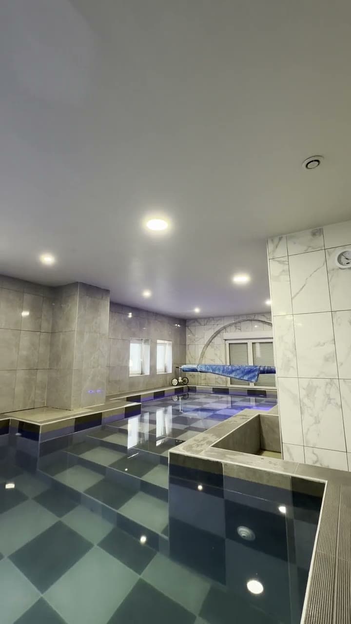 The indoor pool — Alsace · grazing light